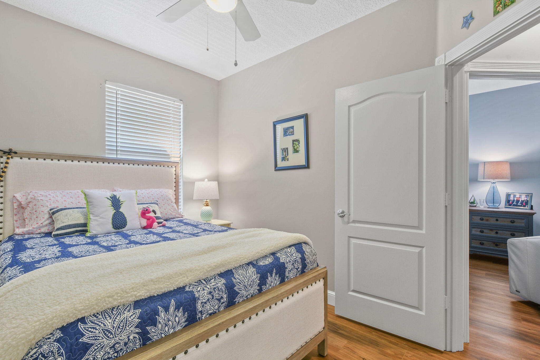 111 Ashley Court Jupiter, FL 33458 - Photo 35 of 68 a bedroom with a bed and a view of kitchen