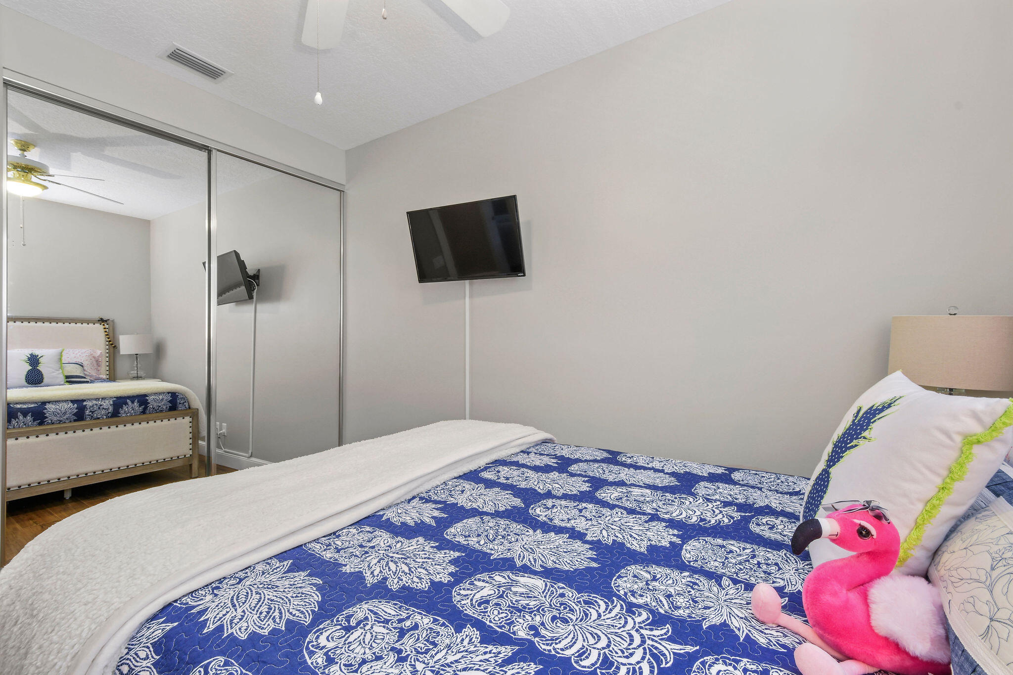 111 Ashley Court Jupiter, FL 33458 - Photo 36 of 68 a bedroom with a bed and a tv