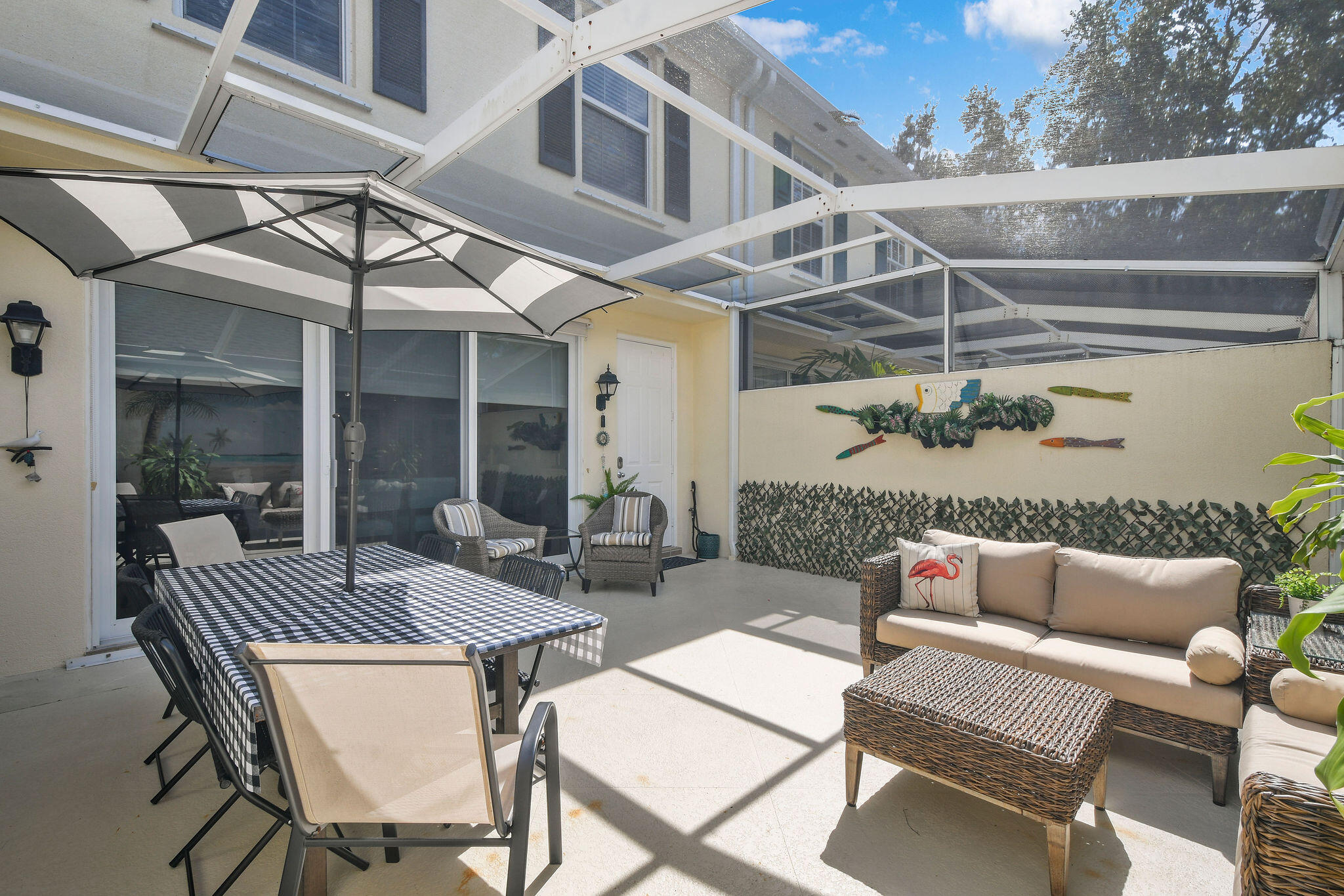 111 Ashley Court Jupiter, FL 33458 - Photo 41 of 68 a view of a patio with a table and chairs