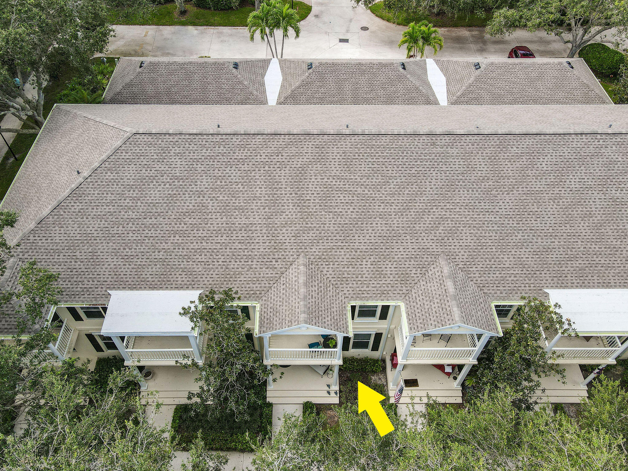 111 Ashley Court Jupiter, FL 33458 - Photo 44 of 68 an aerial view of a house with a garden and parking space