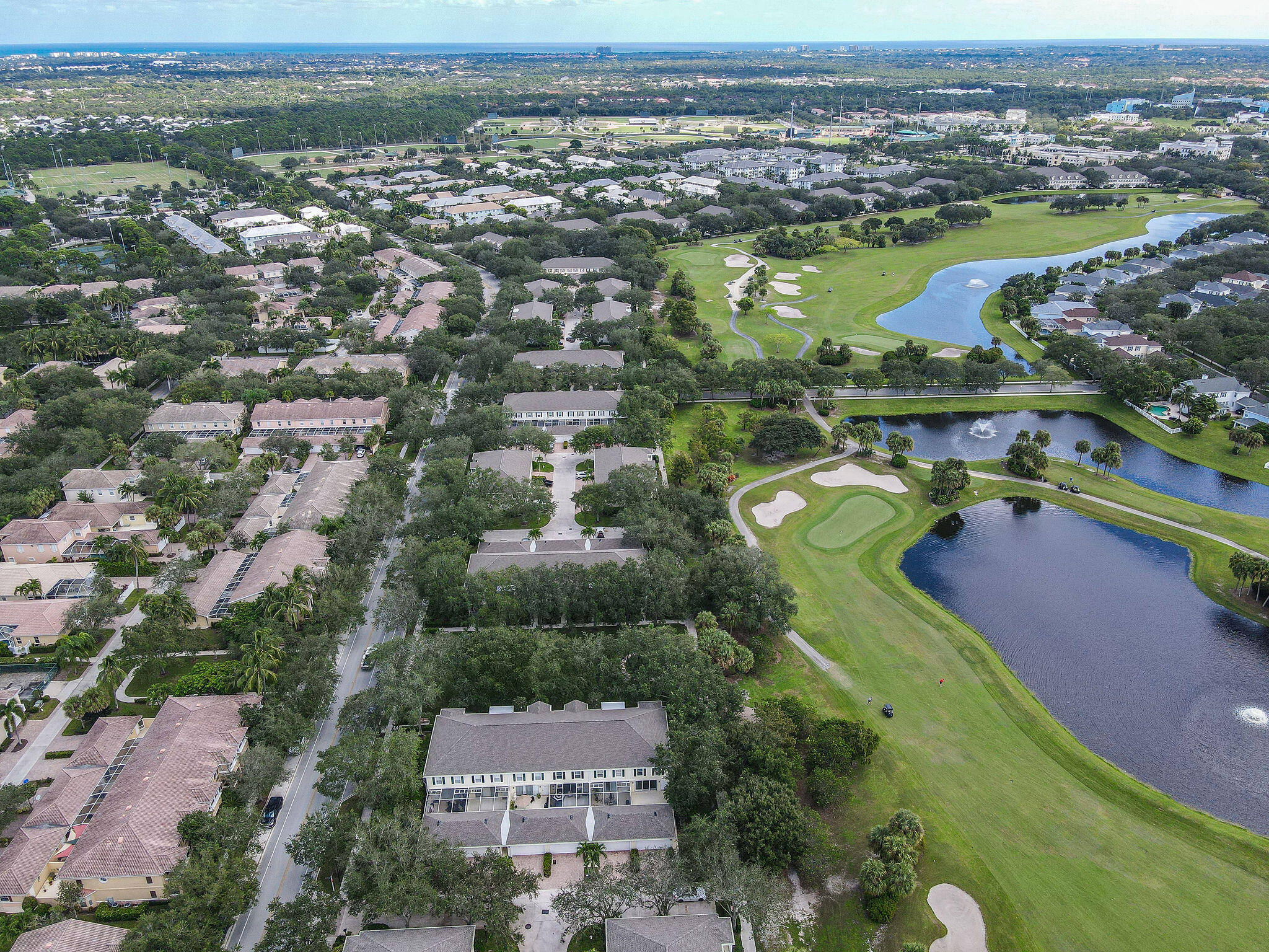 111 Ashley Court Jupiter, FL 33458 - Photo 63 of 68 an aerial view of a residential houses with outdoor space and swimming pool