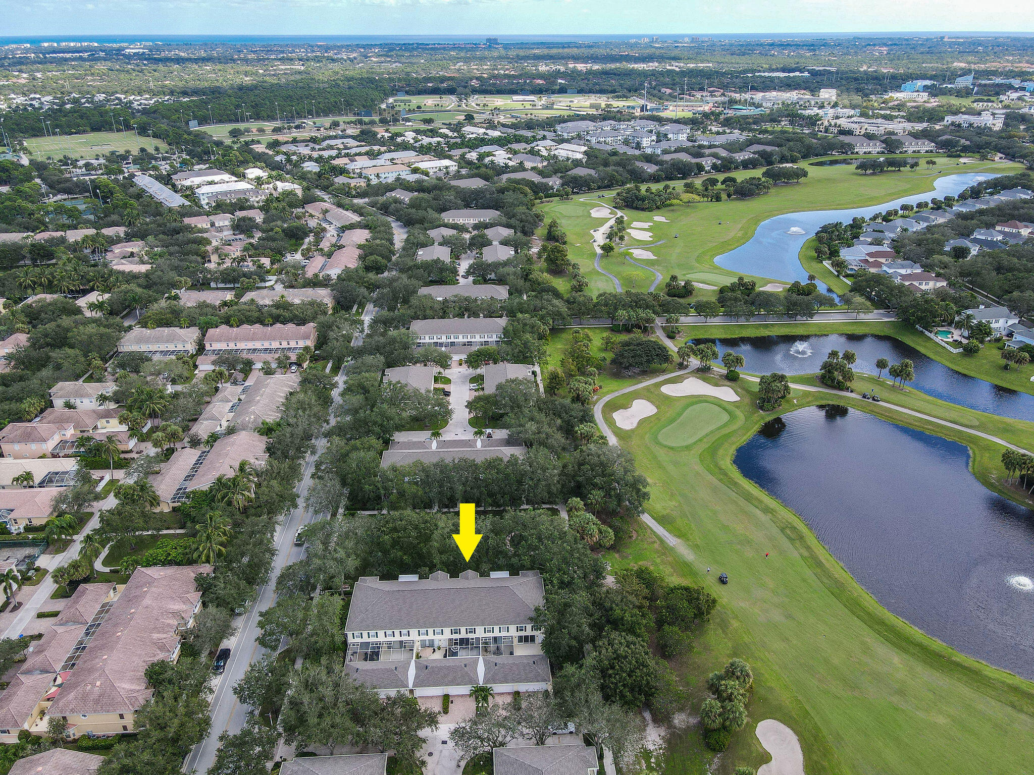 111 Ashley Court Jupiter, FL 33458 - Photo 64 of 68 an aerial view of a houses with a yard