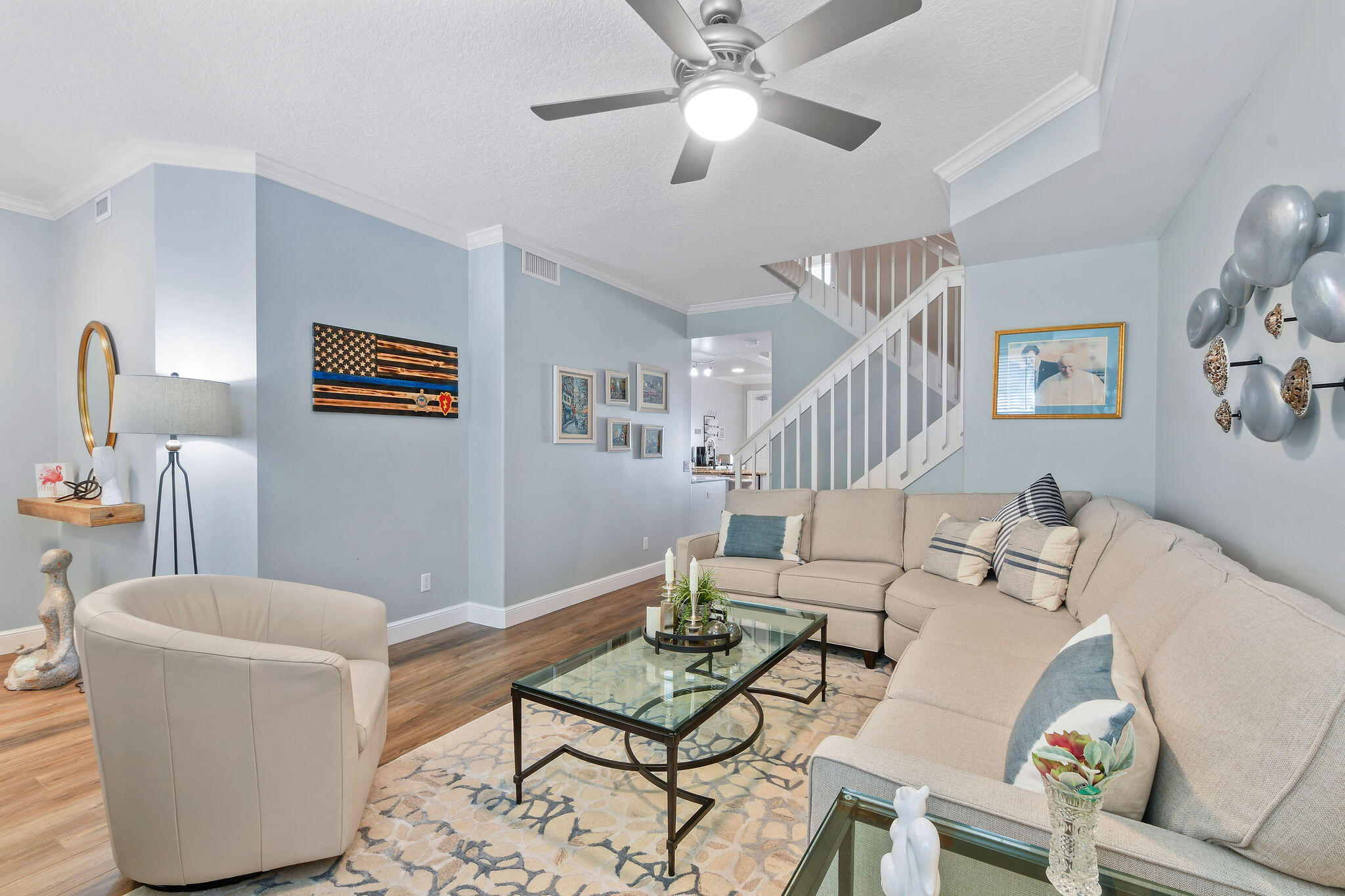 111 Ashley Court Jupiter, FL 33458 - Photo 10 of 68 a living room with furniture and a dining table with wooden floor