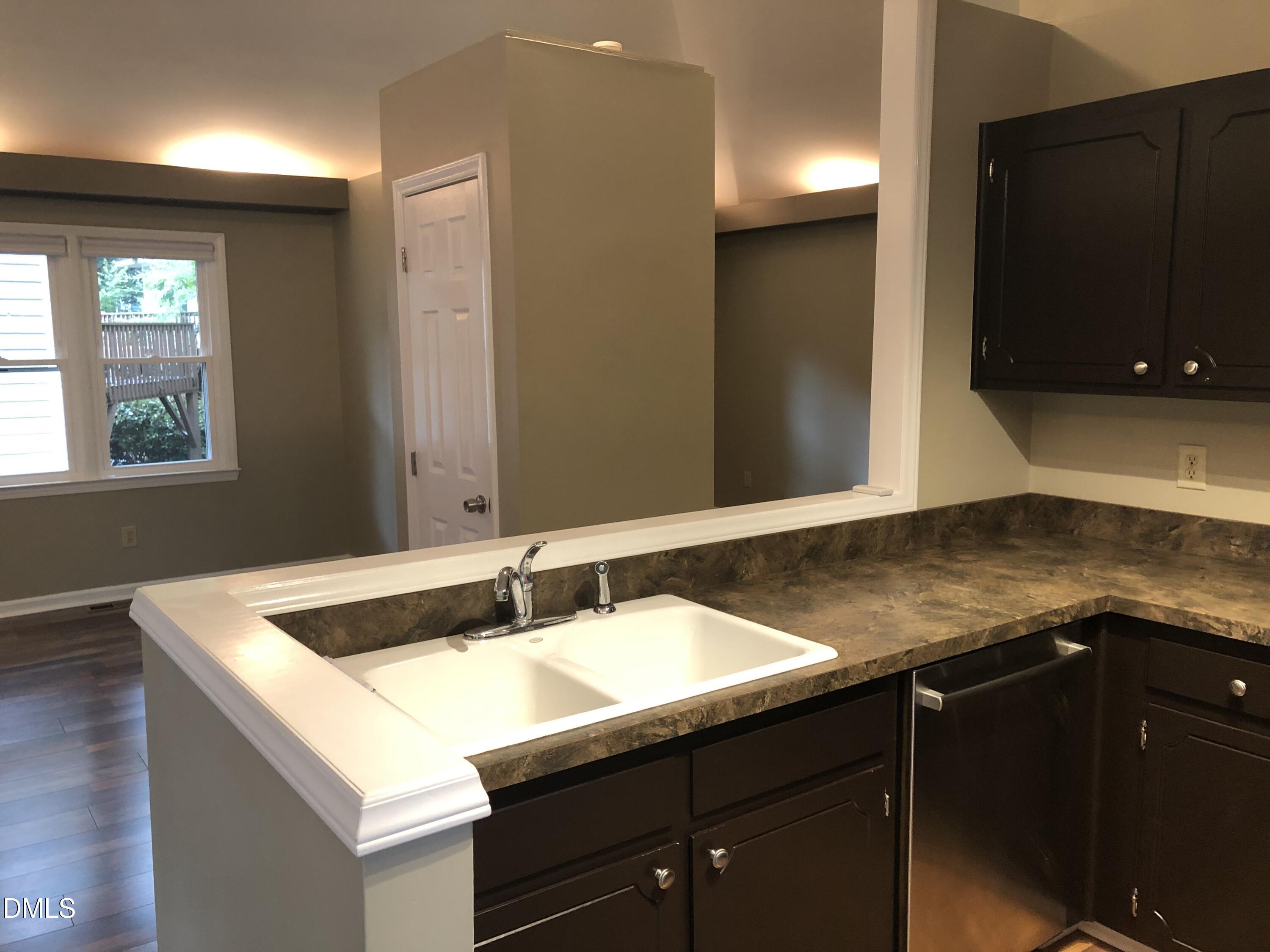 3345 Mill Run Raleigh, NC 27612 - Photo 4 of 11 a bathroom with a sink and a mirror