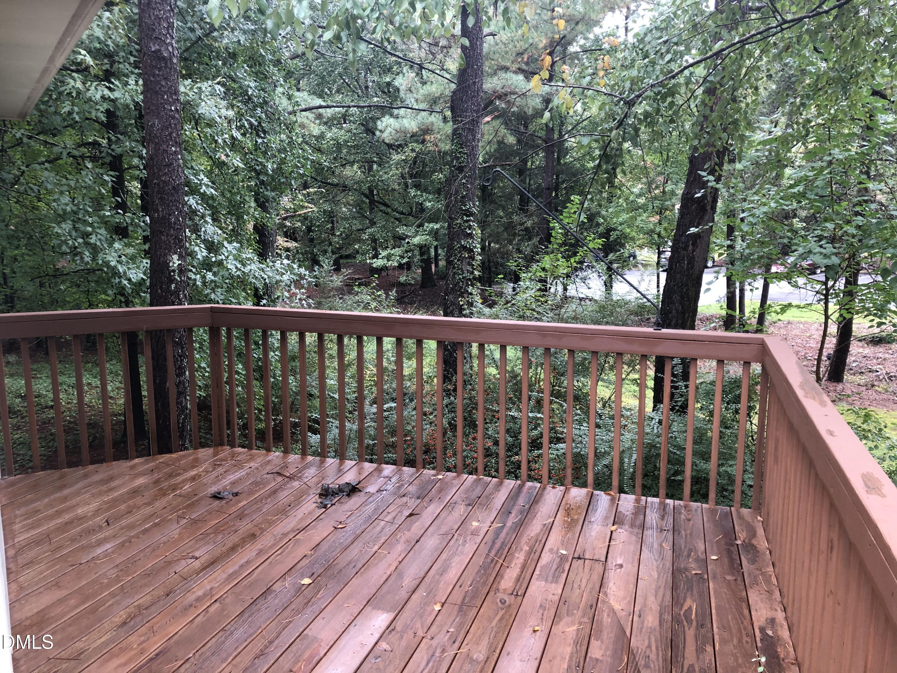 3345 Mill Run Raleigh, NC 27612 - Photo 10 of 11 a balcony with wooden floor and fence