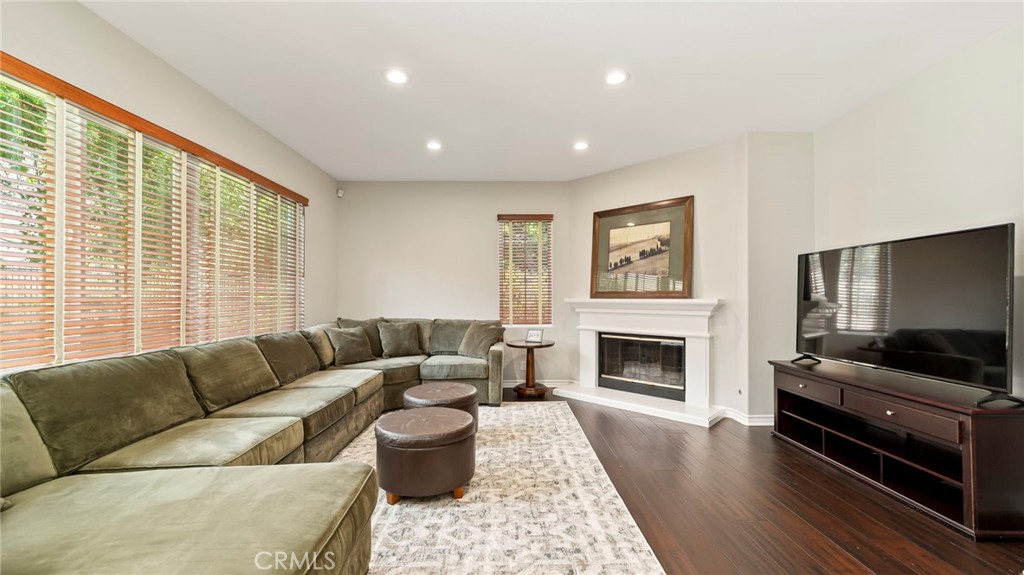637 Chaparral Court Altadena, CA 91001 - Photo 15 of 58 a living room with furniture flat screen tv and a fireplace