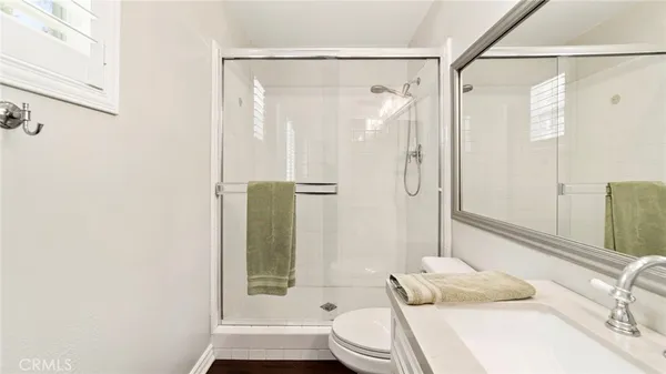 a bathroom with a bathtub sink and mirror