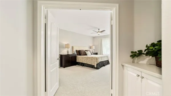 a bedroom with a bed and a view of bathroom