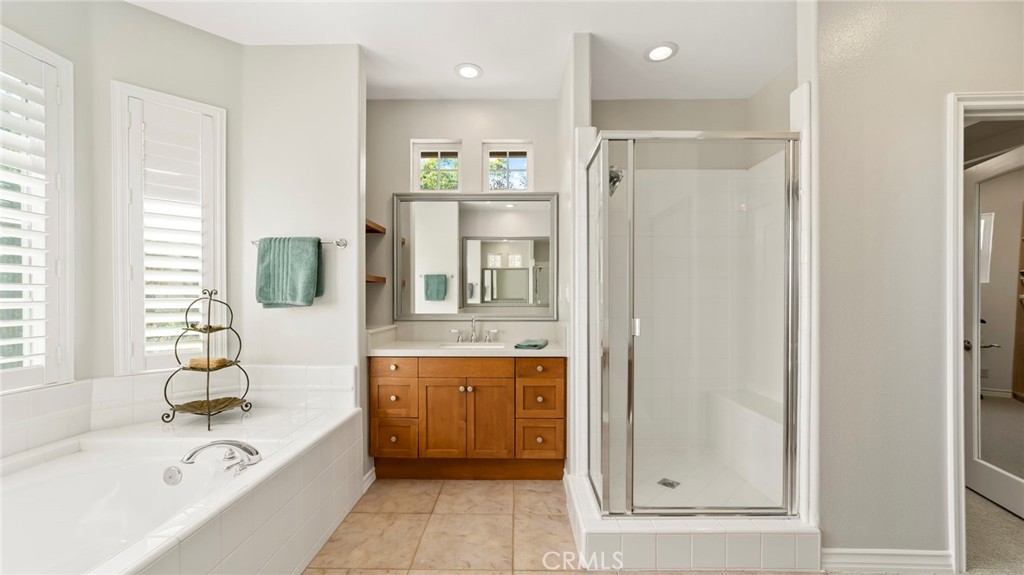 637 Chaparral Court Altadena, CA 91001 - Photo 33 of 58 a bathroom with a tub sink shower and mirror
