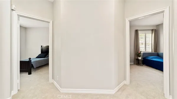 a bedroom with a bed and a chair