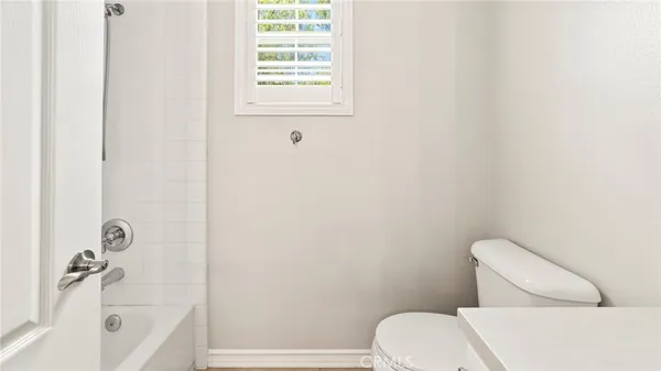 a front view of a house with garden and porch