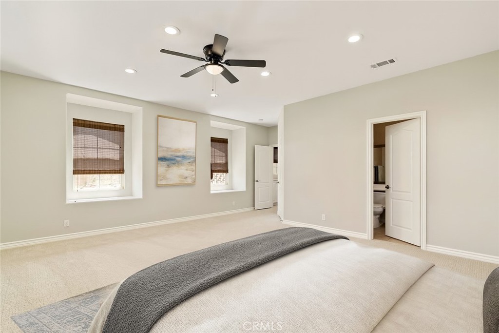 637 Chaparral Court Altadena, CA 91001 - Photo 44 of 58 a bedroom with a large bed chandelier and a window