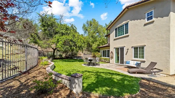 a view of a patio with a chairs and table in patio