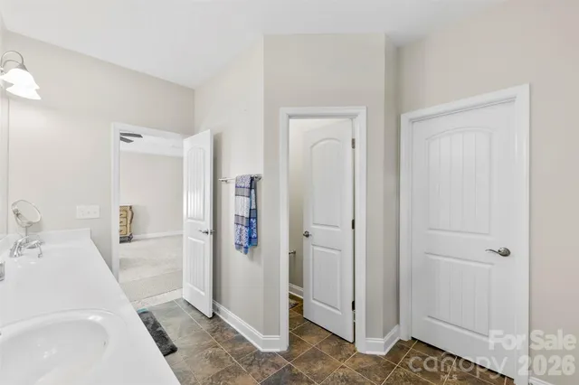 a en suite bathroom with a sink a mirror and a shower