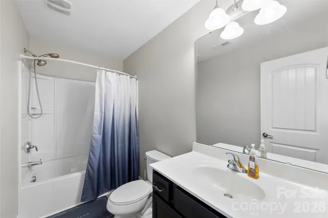 a bathroom with a sink toilet tub and shower