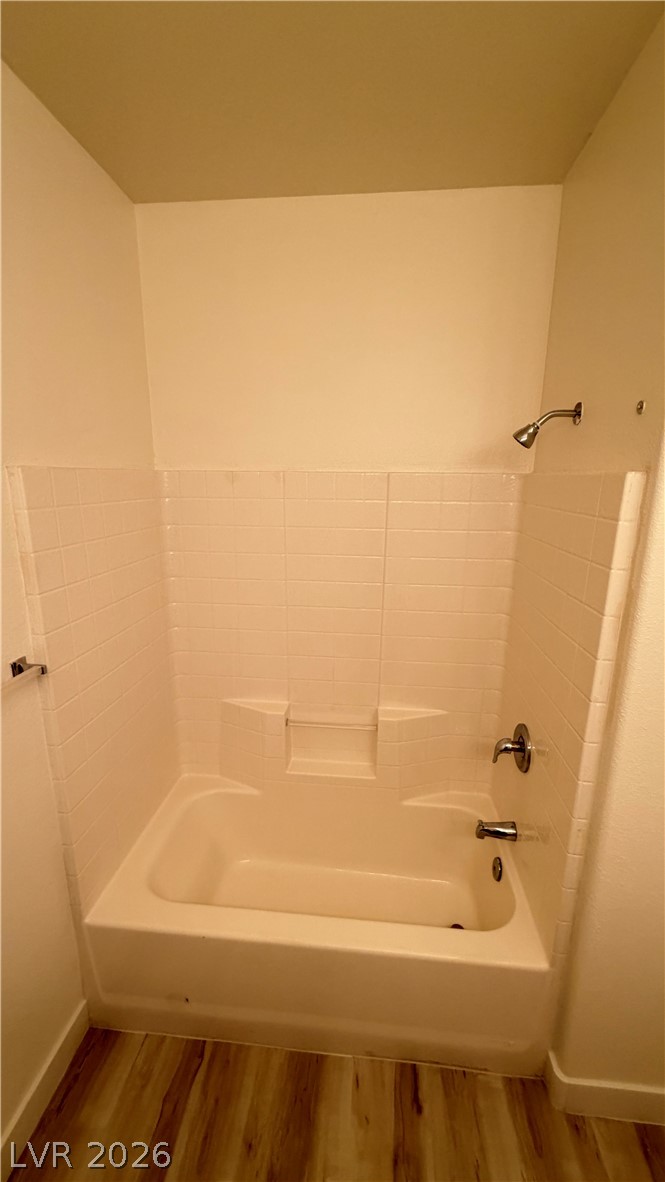 Clean lines and classic tile surround this functional tub and shower combination.