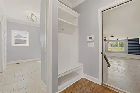 a spacious bathroom with a granite countertop tub sink shower and mirror