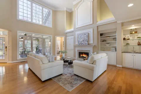 a view of a livingroom with furniture and a potted plant