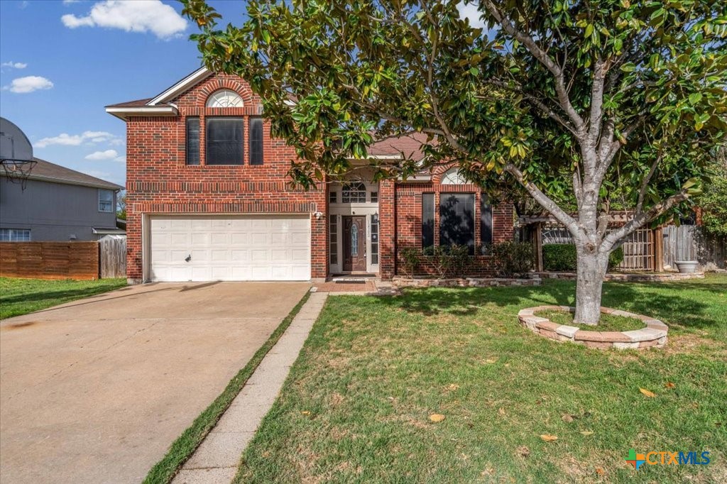 12502 Fallen Tower Lane Austin, TX 78753 - Photo 1 of 28 a front view of a house with a yard