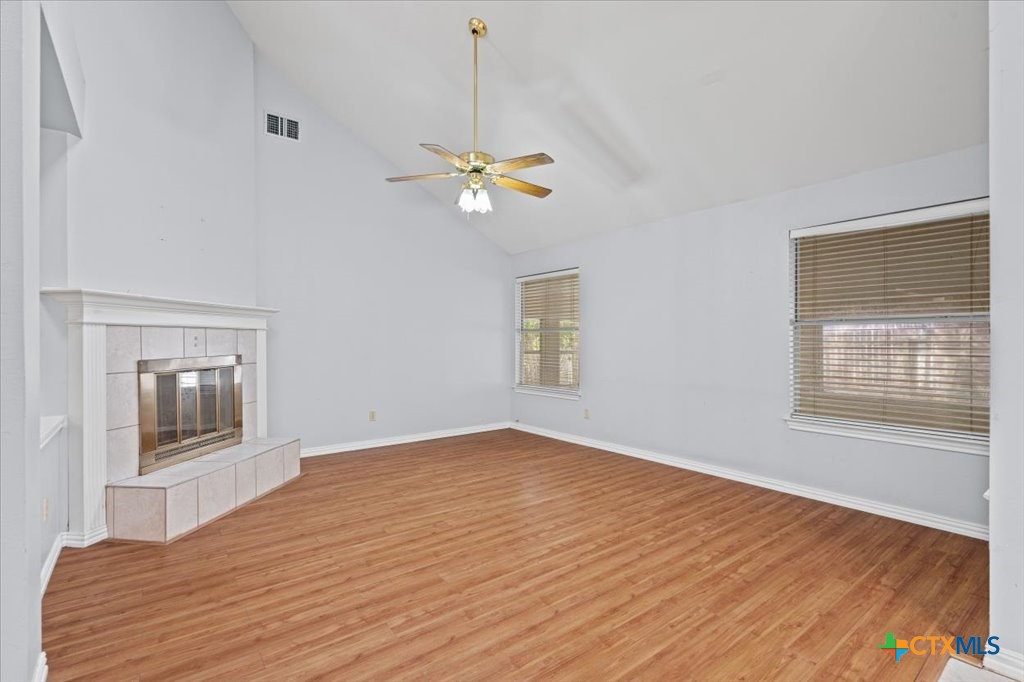 12502 Fallen Tower Lane Austin, TX 78753 - Photo 10 of 28 a view of empty room with wooden floor and fan