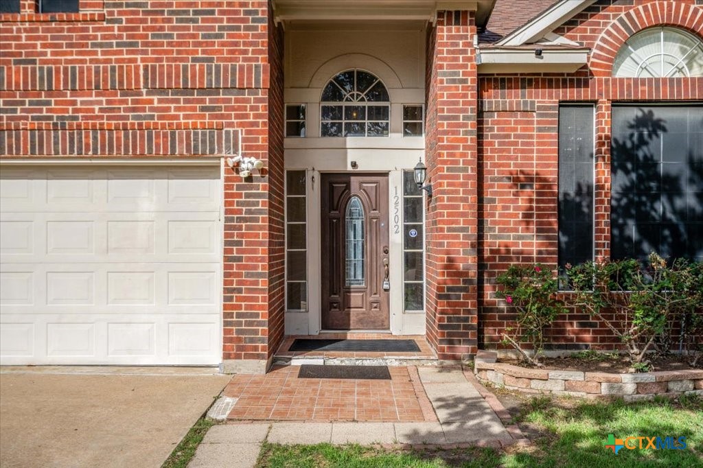 12502 Fallen Tower Lane Austin, TX 78753 - Photo 2 of 28 a front view of a house with a yard
