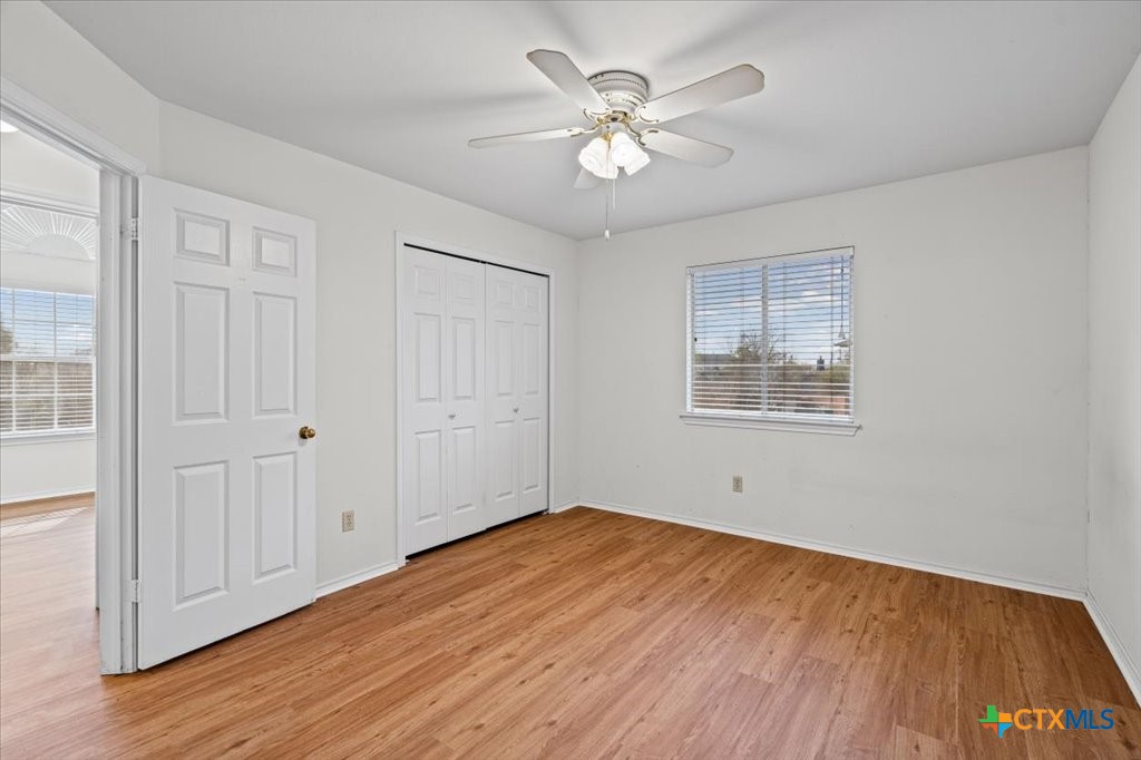 12502 Fallen Tower Lane Austin, TX 78753 - Photo 20 of 28 a view of an empty room with wooden floor