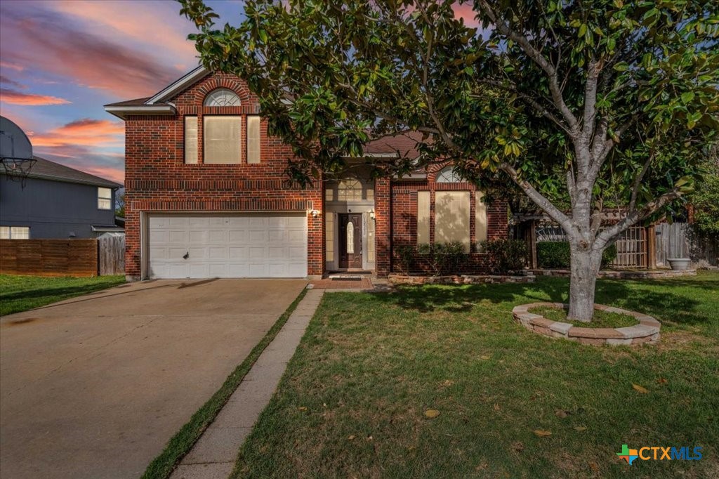 12502 Fallen Tower Lane Austin, TX 78753 - Photo 24 of 28 a front view of a house with a yard