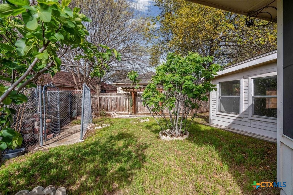 12502 Fallen Tower Lane Austin, TX 78753 - Photo 25 of 28 a view of a yard in front of house with a large tree