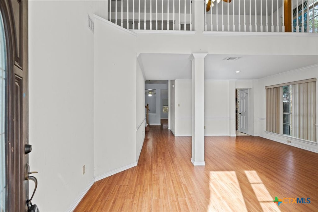 12502 Fallen Tower Lane Austin, TX 78753 - Photo 3 of 28 a view of a room with wooden floor and a bathroom