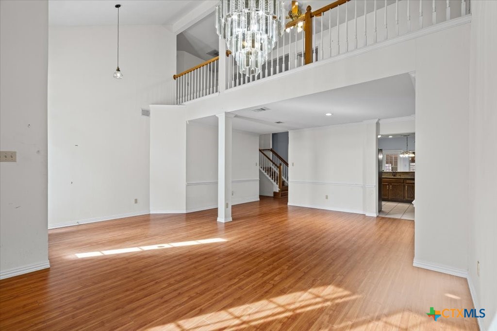12502 Fallen Tower Lane Austin, TX 78753 - Photo 5 of 28 a view of an empty room with wooden floor