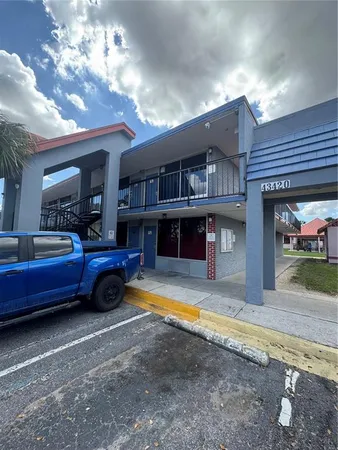 a view of a house with tub and fire pit