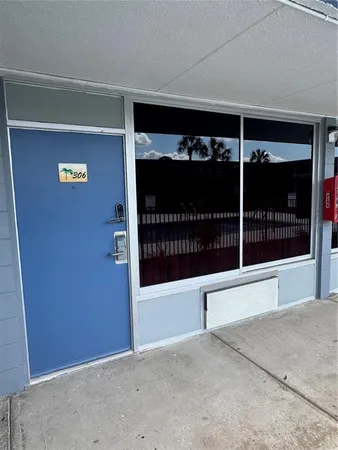 a view of a door and an empty room