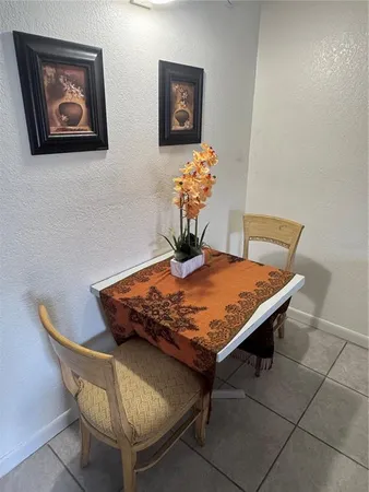 a wooden table sitting in a room with a table