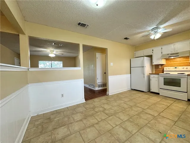 a view of a kitchen with a sink