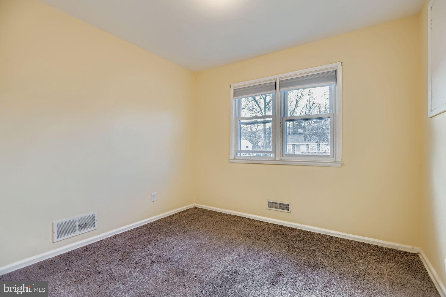 8504 Fieldway Drive Randallstown, MD 21133 - Photo 7 of 20 an empty room with a window