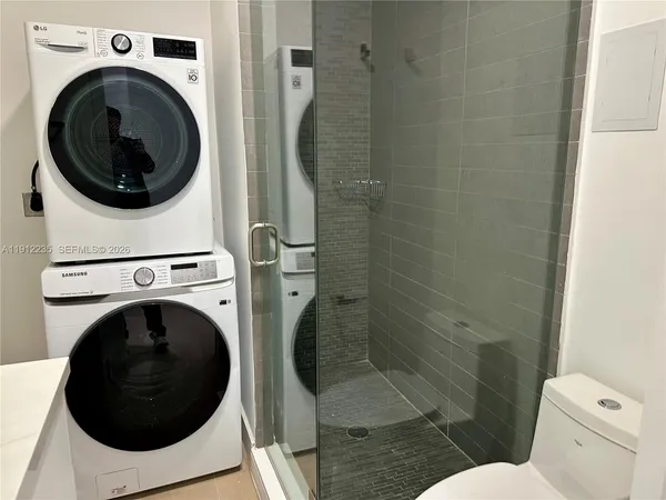 a utility room with dryer and washer