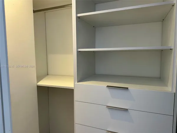 a view of an empty walk in closet
