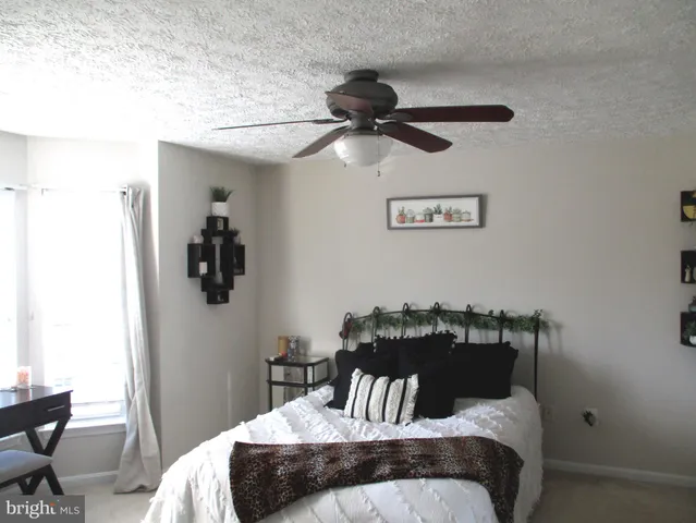 a bedroom with a bed and cabinets