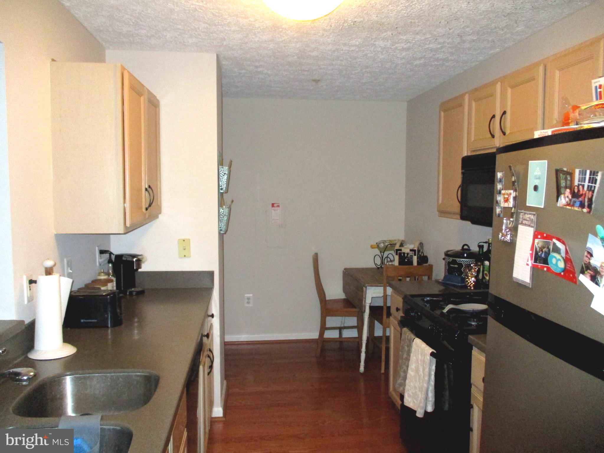 2003 Phillips Terrace, Unit 6 Annapolis, MD 21401 - Photo 7 of 11 a living room with furniture and a flat screen tv