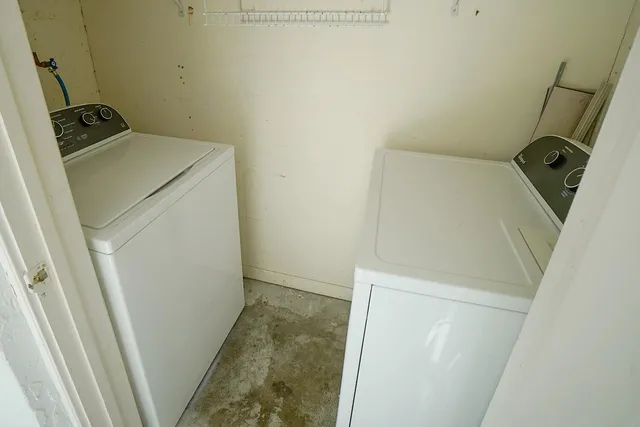 a view of storage and utility room with a sink
