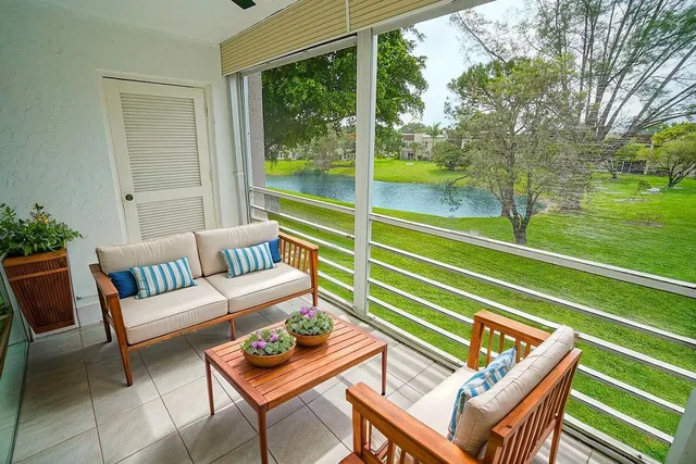 a view of a two chairs in the patio