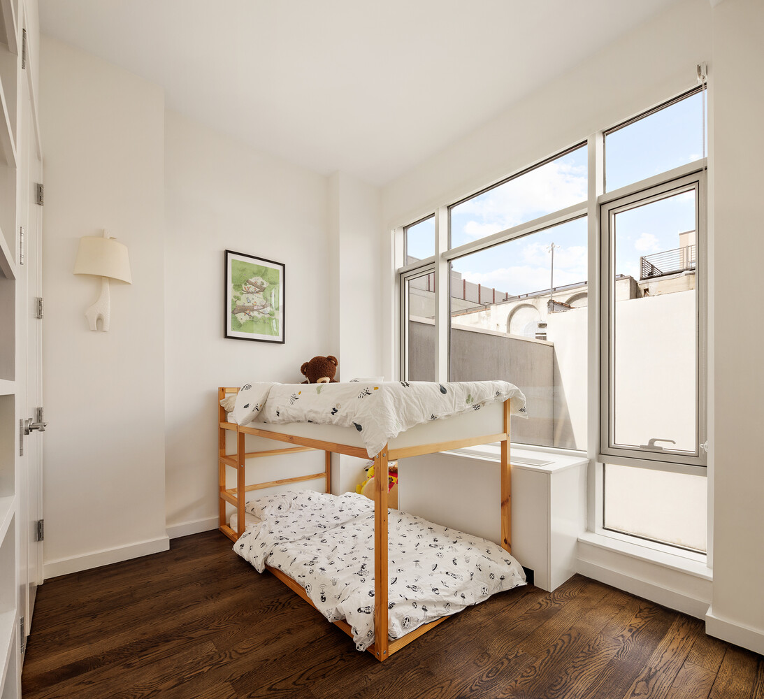 101 North 5th Street, Unit 2AB Brooklyn, NY 11249 - Photo 12 of 13 a living room with furniture and a window