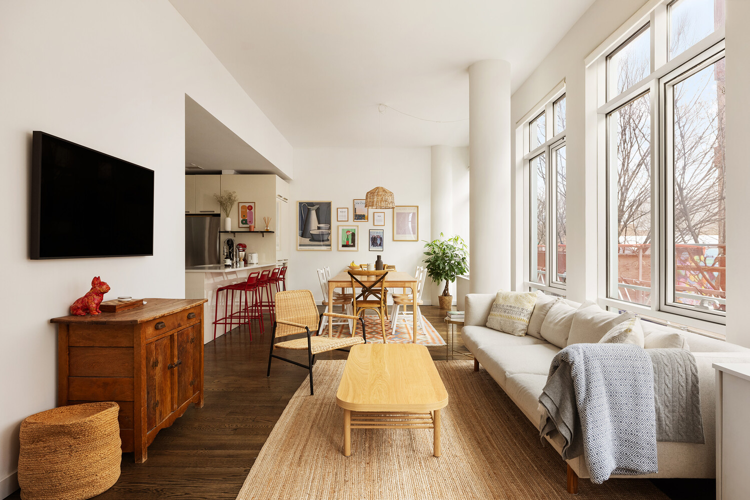 101 North 5th Street, Unit 2AB Brooklyn, NY 11249 - Photo 1 of 13 a living room with furniture and a flat screen tv