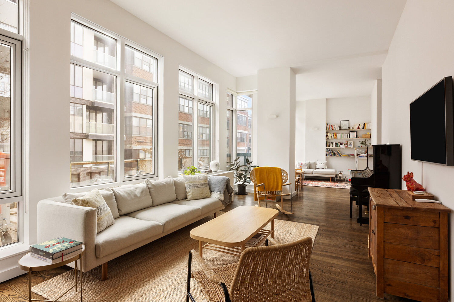 101 North 5th Street, Unit 2AB Brooklyn, NY 11249 - Photo 3 of 13 a living room with furniture and a flat screen tv