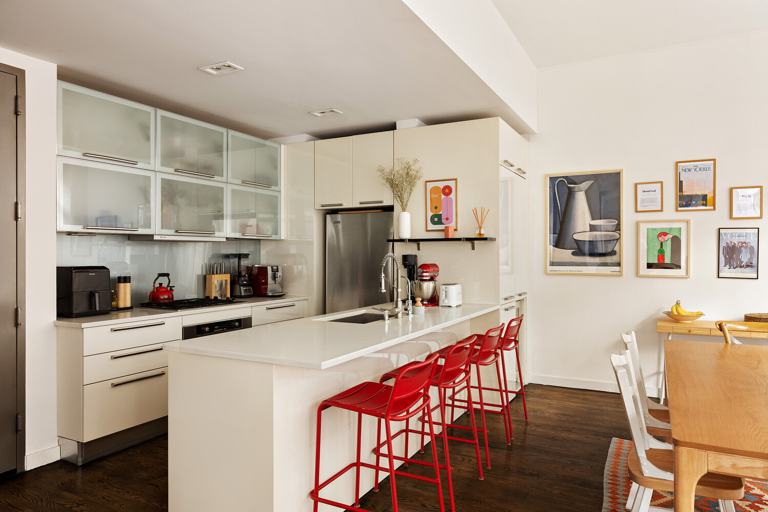 101 North 5th Street, Unit 2AB Brooklyn, NY 11249 - Photo 4 of 13 a kitchen with stainless steel appliances a refrigerator a stove a sink dishwasher and white cabinets with wooden floor