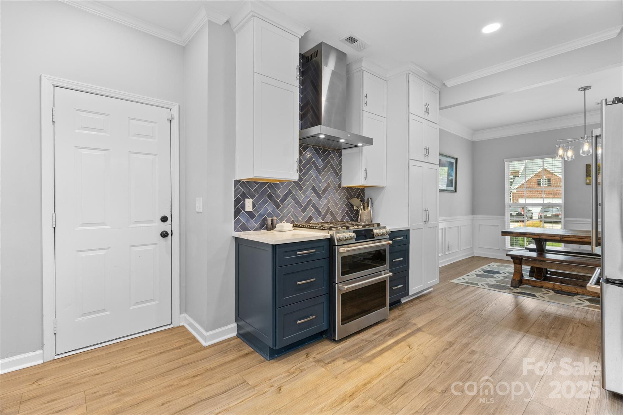 879 Knightsbridge Road Fort Mill, SC 29708 - Photo 13 of 42 a kitchen with stainless steel appliances granite countertop a stove and a sink