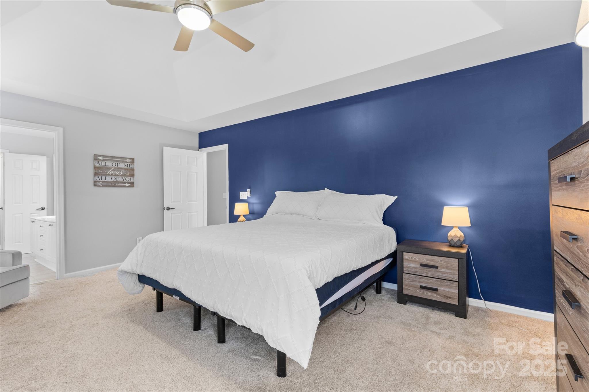 879 Knightsbridge Road Fort Mill, SC 29708 - Photo 24 of 42 a spacious bedroom with a bed and a lamp