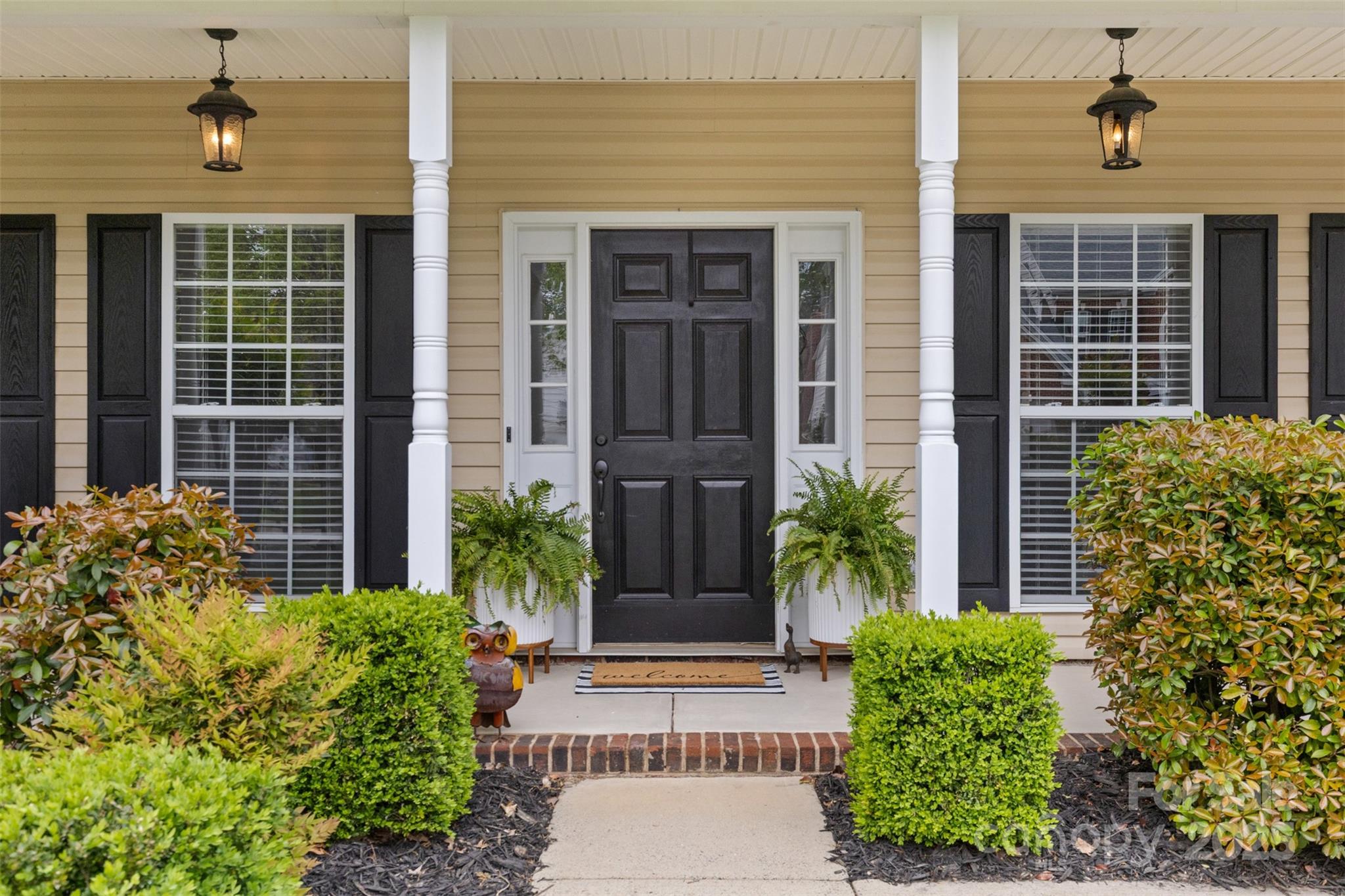 879 Knightsbridge Road Fort Mill, SC 29708 - Photo 5 of 42 a front view of a house having yard and glass windows