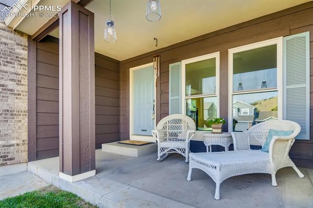 7390 Julynn Road Colorado Springs, CO 80919 - Photo 5 of 35 Enjoy summer evenings on the front porch!