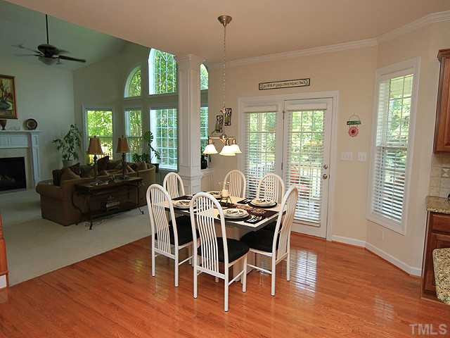 10537 Swerling Way Raleigh, NC 27614 - Photo 5 of 12 Great flow through area from kitchen to family room and French doors to the screened porch and grilling patio. Breakfast Area